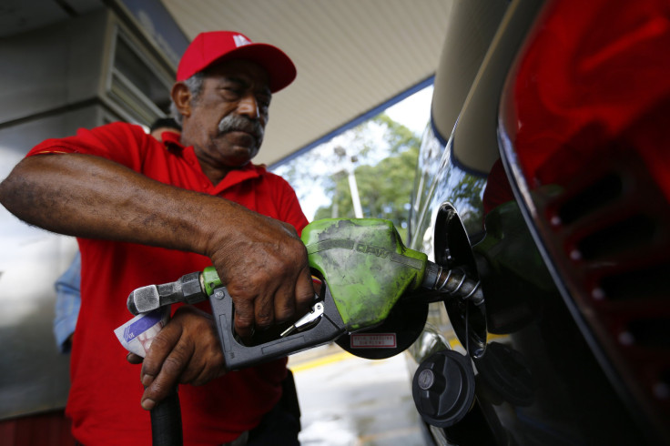 A man pumps gasoline at a service station. California cleantech company Siluria Technologies says its process can make cheap gasoline from natural gas.