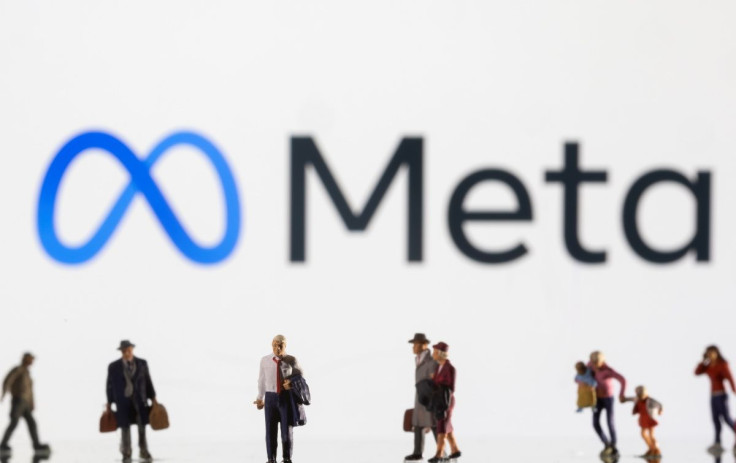 Small figurines are seen in front of displayed Meta logo in this illustration taken February 11, 2022. 