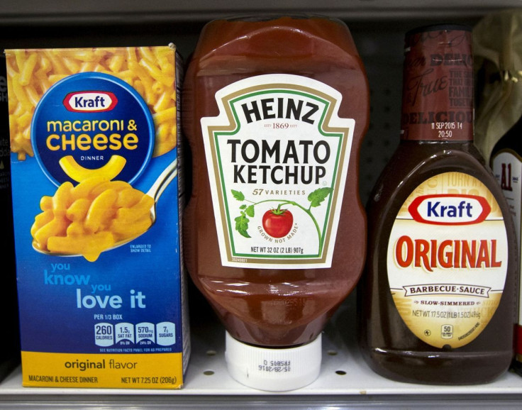 A Heinz Ketchup bottle sits between a box of Kraft macaroni and cheese and a bottle of Kraft Original Barbecue Sauce on a grocery store shelf in New York March 25, 2015.  