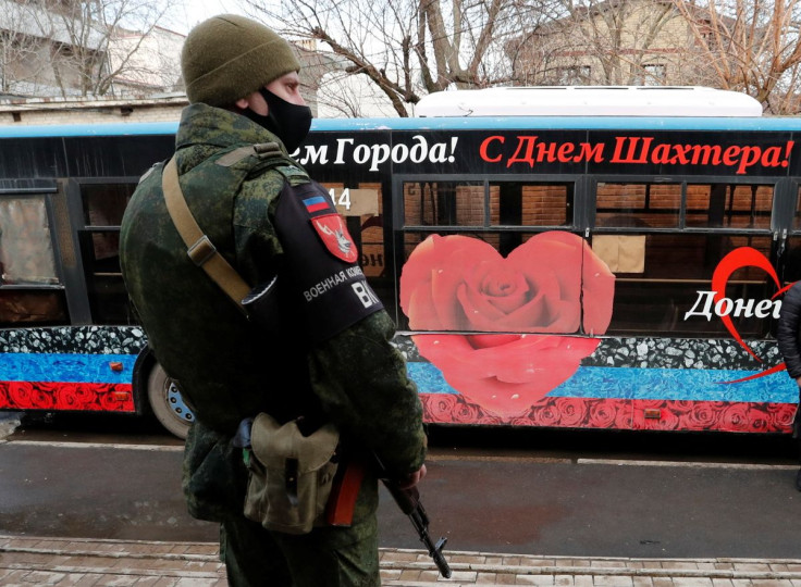 A militant of the self-proclaimed Donetsk People's Republic stands outside a military mobilization point in the separatist-controlled city of Donetsk, Ukraine February 23, 2022.