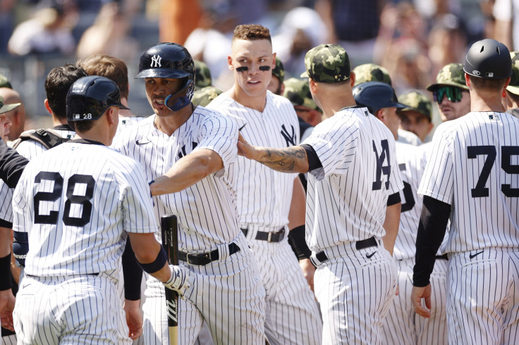 Giancarlo Stanton #27 holds back Josh Donaldson #28 of the New York Yankees after Donaldson's benches-clearing dispute with Yasmani Grandal #24 of the Chicago White Sox during the fifth inning at Yankee Stadium on May 21, 2022 in the Bronx borough of New 