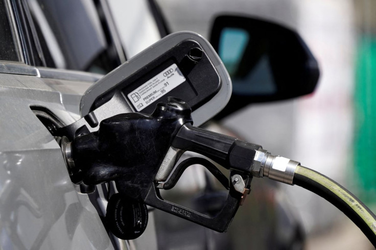 A gas pump is inserted inside an Audi vehicle at a Mobil gas station in Beverly Boulevard in West Hollywood, California, U.S., March 10, 2022. 