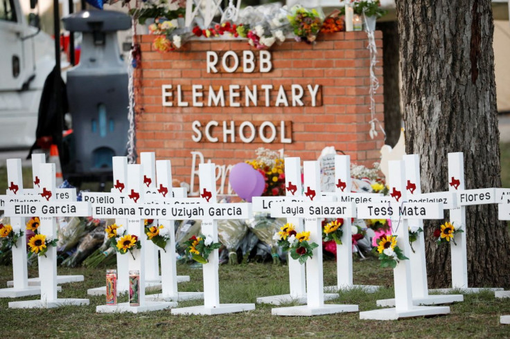 Crosses with the names of victims of a school shooting, are pictured at a memorial outside Robb Elementary school, after a gunman killed nineteen children and two teachers, in Uvalde, Texas, U.S. May 26, 2022. 