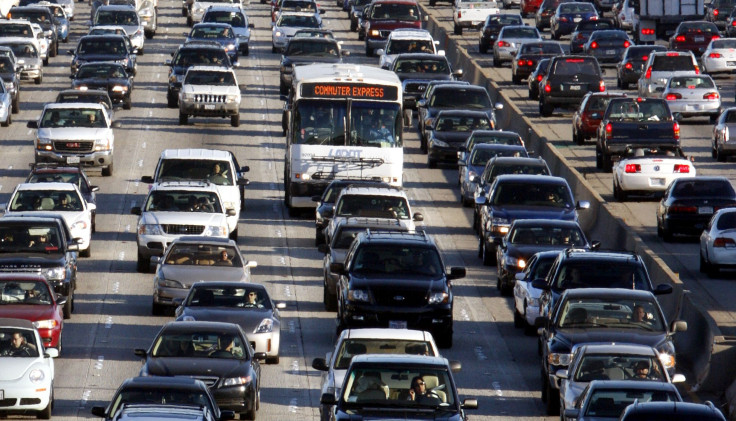 Vehicles are seen during rush hour on the 405 freeway in Los Angeles, California October 3, 2007. In Los Angeles, more than 67 percent of working adults drive alone to work, according to a survey of U.S. census data released Wednesday.