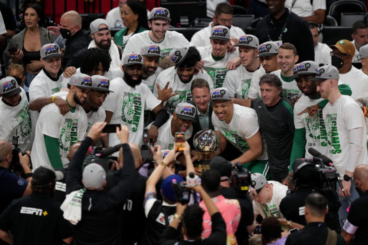 The Boston Celtics celebrates with the Eastern Conference Bob Cousy champions trophy after defeating the Miami Heat in Game Seven to win the 2022 NBA Playoffs Eastern Conference Finals at FTX Arena on May 29, 2022 in Miami, Florida.