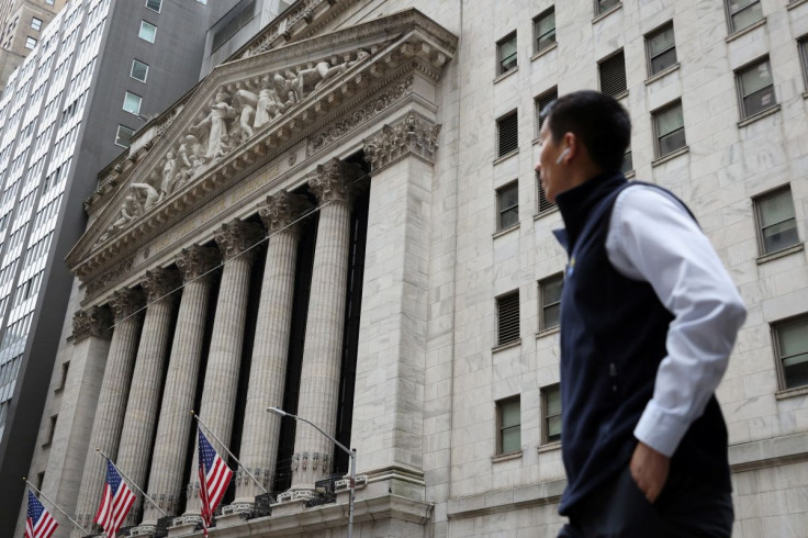 A person walks by the New York Stock Exchange (NYSE) in Manhattan, New York City, U.S., May 19, 2022.