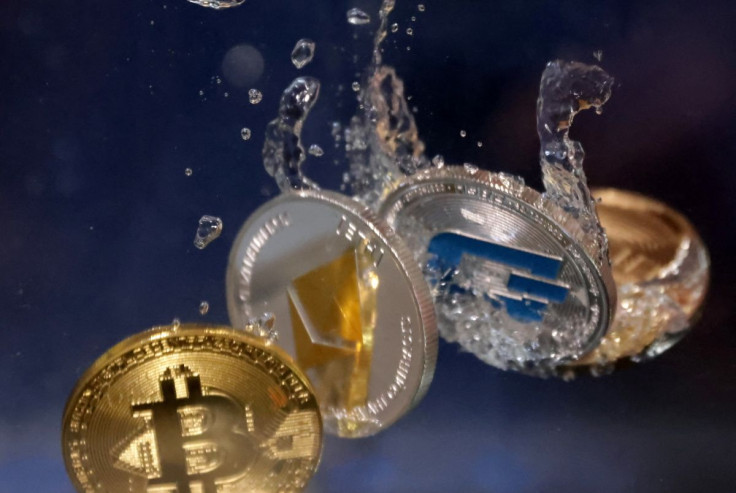 Representations of cryptocurrency Bitcoin, Ethereum and Dash plunge into water in this illustration taken, May 23, 2022.