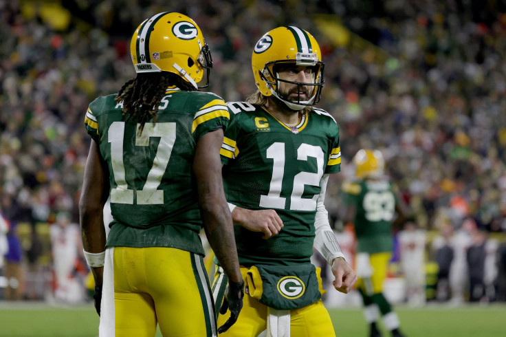 Davante Adams #17 and Aaron Rodgers #12 of the Green Bay Packers celebrate after scoring a touchdown in the second quarter against the Cleveland Browns at Lambeau Field on December 25, 2021 in Green Bay, Wisconsin.