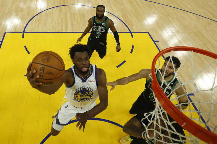 Andrew Wiggins #22 of the Golden State Warriors drives to the basket against Jaylen Brown #7 and Jayson Tatum #0 of the Boston Celtics during the first half in Game Five of the 2022 NBA Finals at Chase Center on June 13, 2022 in San Francisco, California.