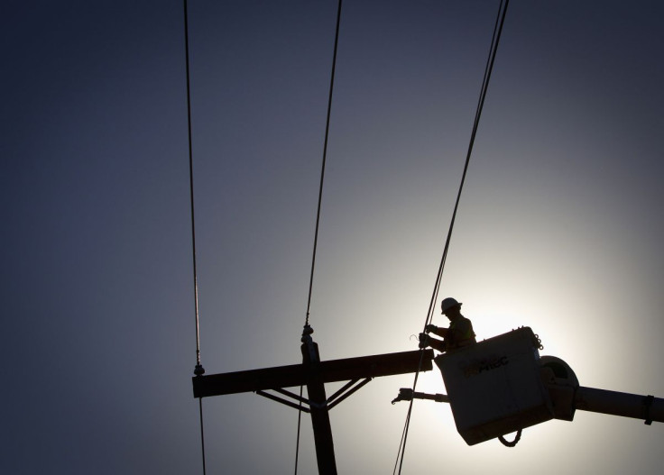 An electrical line technician works on restoring power after a tornado Vilonia, Arkansas April 29, 2014.