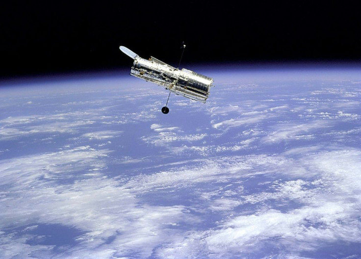 The Hubble Space Telescope, the world's first space telescope which has revolutionized astronomy, as seen from the Space Shuttle Discovery. It is named after famed astronomer Edwin Hubble.