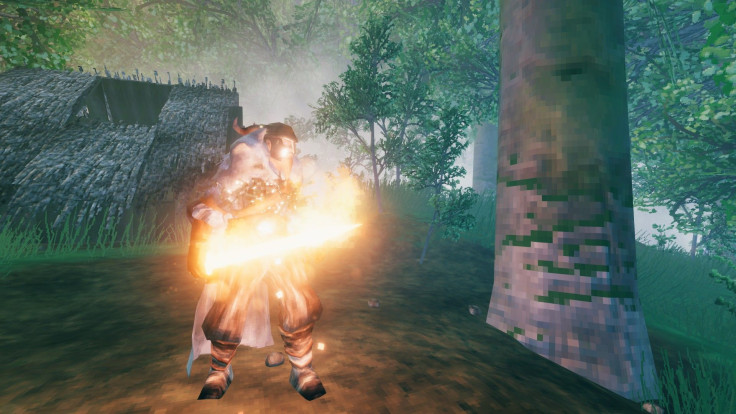 The flaming sword Dyrnwyn being held by a Viking in Valheim.