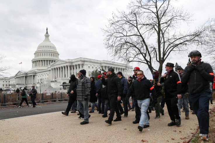Members of the the far-right group Proud Boys march to the U.S. Capitol Building in Washington, U.S., January 6, 2021.