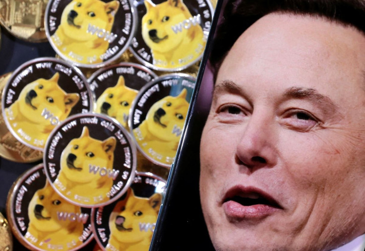 A photo of Elon Musk is displayed on a smartphone placed on representations of cryptocurrency Dogecoin in this illustration taken June 16, 2022.