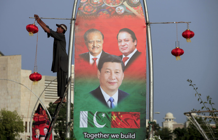 A file picture of a banner showing Pakistani leaders and China's President Xi Jinping. 