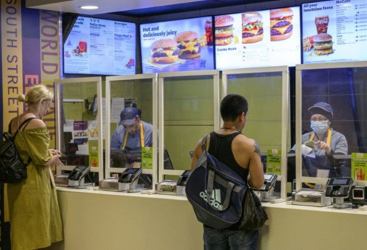 Employees at a McDonald's restaurant in New York are seen on May 27, 2022.