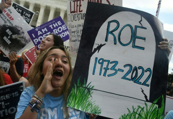 Anti-abortion activists  celebrate outside the US Supreme Court