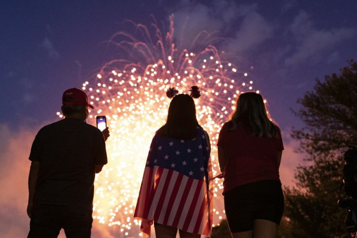 Visitors watch the Independence Day fireworks display near the Lincoln Memorial on the National Mall on July 4, 2021, in Washington, D.C.
