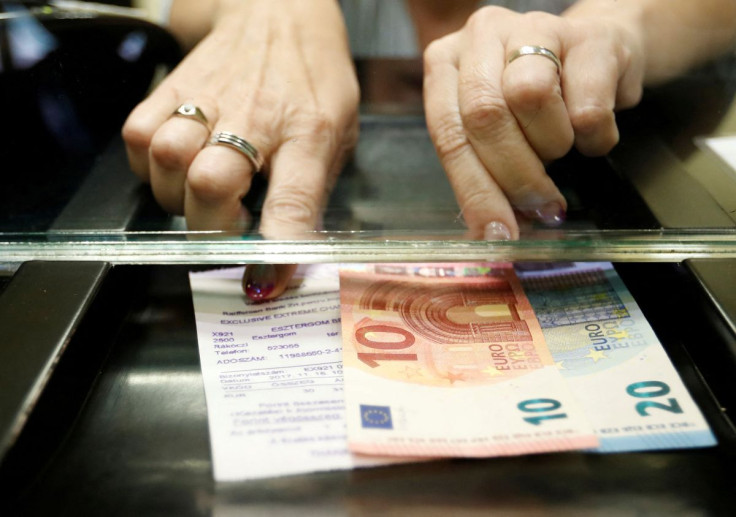 A Hungarian woman exchanges forints for euros at a currency exchange shop in Esztergom, Hungary November 11, 2017. Picture taken November 11, 2017.