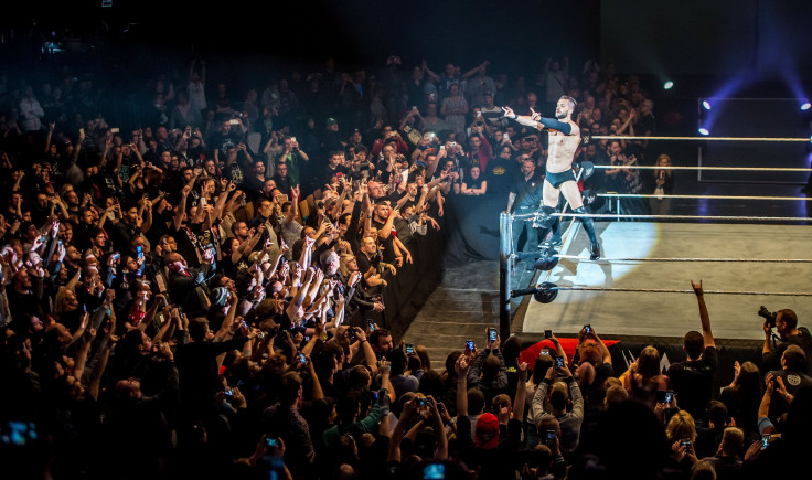 Finn Balor celebrates victory during a WWE show at Zenith Arena on may 09, 2017 in Lille, France.