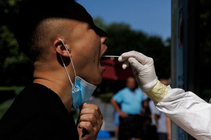A man gets a swab test at a nucleic acid testing station, following a coronavirus disease (COVID-19) outbreak, in Beijing, China, July 14, 2022.