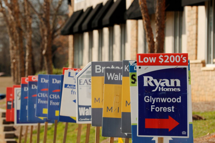 Real estate signs advertise new homes for sale in multiple new developments in York County, South Carolina, U.S., February 29, 2020.