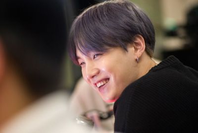 Suga of BTS visit The Elvis Duran Z100 Morning Show at Z100 Studio on April 12, 2019 in New York City.