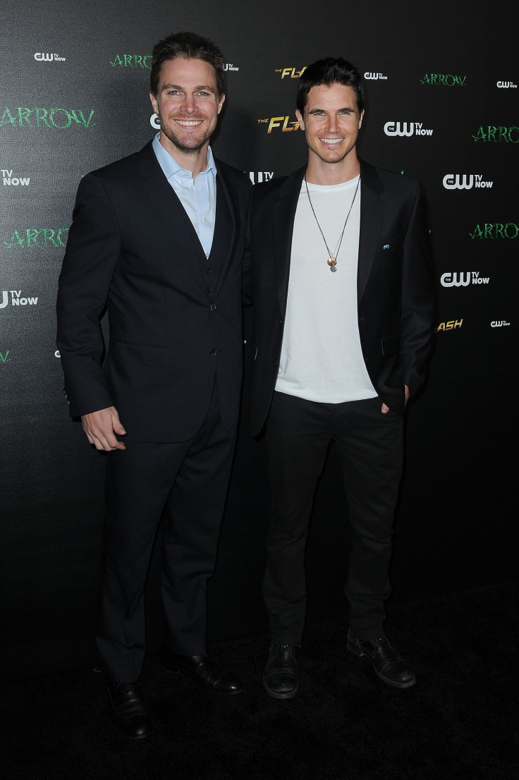 Stephen Amell (left) and Robbie Amell have created a movie together called "Code 8." The cousins are pictured at a special screening for "Arrow" and "The Flash" in Westwood, California, on Nov. 22, 2014.
