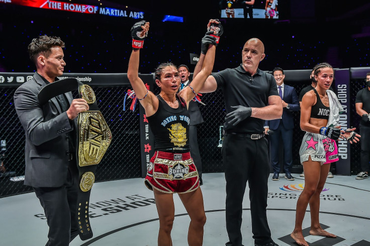 Janet Todd (center) was declared the new ONE interim atomweight Muay Thai champion after a grueling five-round fight with Lara Fernandez (right) at ONE 159 on July 22, 2022.
