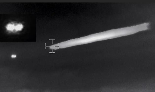 A UFO flying away from a plume in this frame from the 2014 Chile helicopter video.