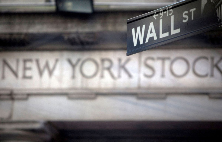 A Wall Street sign is pictured outside the New York Stock Exchange in New York, October 28, 2013.