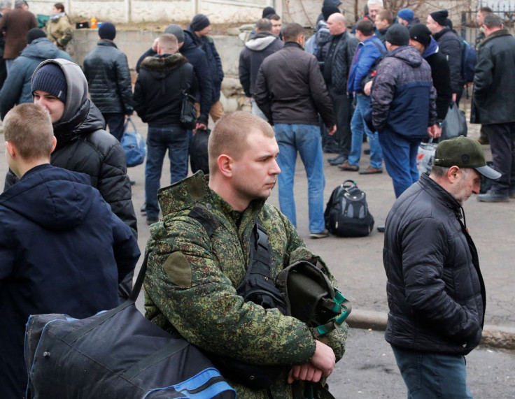 Men gather at a military mobilization point in the separatist-controlled city of Donetsk, Ukraine February 23, 2022.