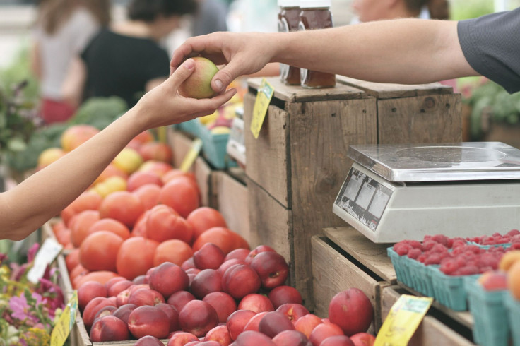 Representation. A vendor selling an apple to a customer.