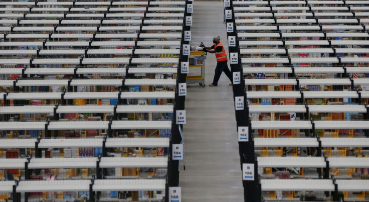 A worker collects orders at Amazon's fulfilment centre in Rugeley, central England