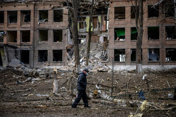 A man walks in front of a destroyed building after a Russian missile attack in the Ukrainian town of Vasylkiv, near Kyiv.