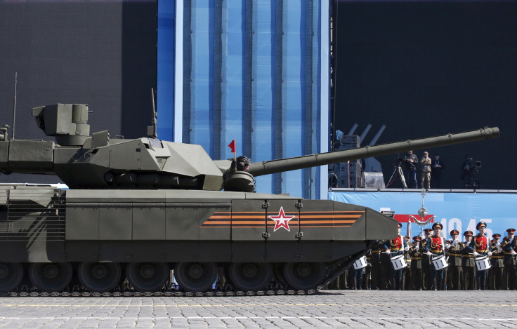 Russia's prized Armata tank is expected to feature a number of technological upgrades and is scheduled to begin testing next year. Above, a Russian serviceman holds a red flag aboard a T-14 Armata tank after it stopped during a rehearsal for the Victory D