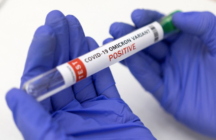 Illustration shows test tube labelled "COVID-19 Omicron variant test positive