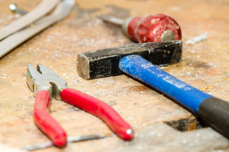 Bank manager fends off robber with plier