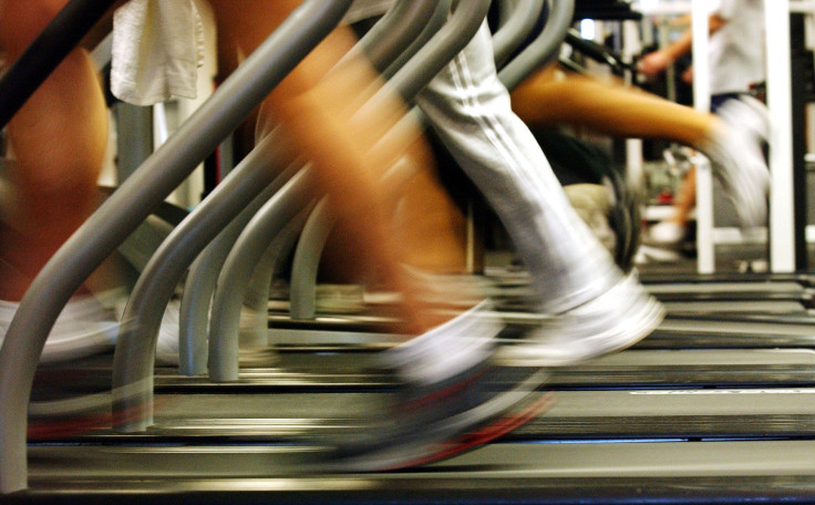 People run on treadmills at a New York Sports Club Jan. 2, 2003 in Brooklyn, New York.