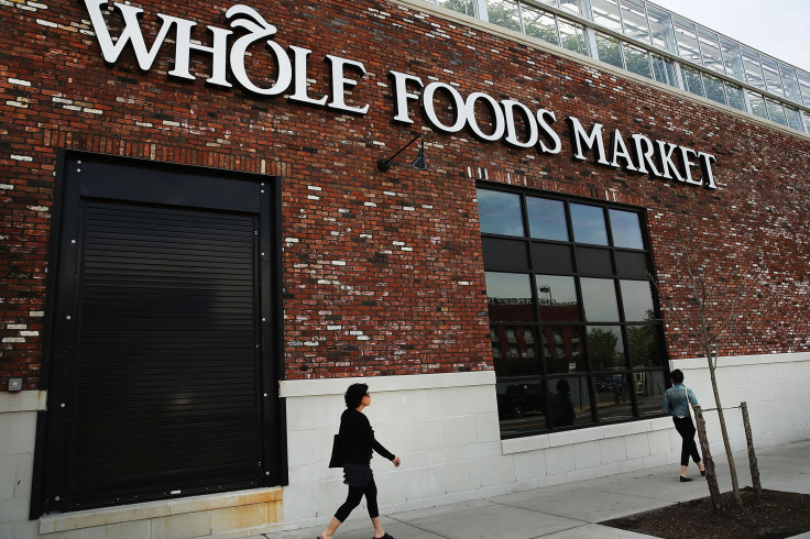 People walk past a Whole Foods Market in the Brooklyn borough of New York City, May 7, 2014. Whole Foods Market will post earnings after markets close Thursday in New York. The Austin, Texas-based high-end grocer is expected to report a 6.4 percent rise i