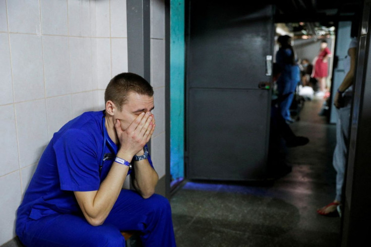 A doctor takes shelter in the basement of a perinatal centre as air raid siren sounds are heard in Kyiv, Ukraine, March 2, 2022.