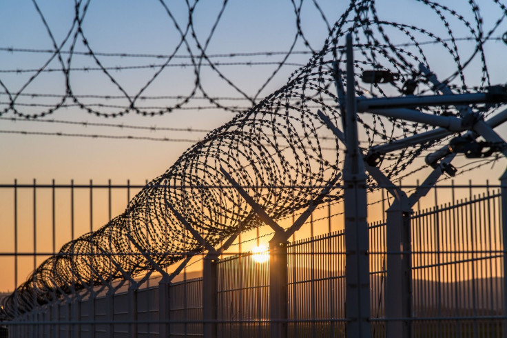 Representation. A prison fence.