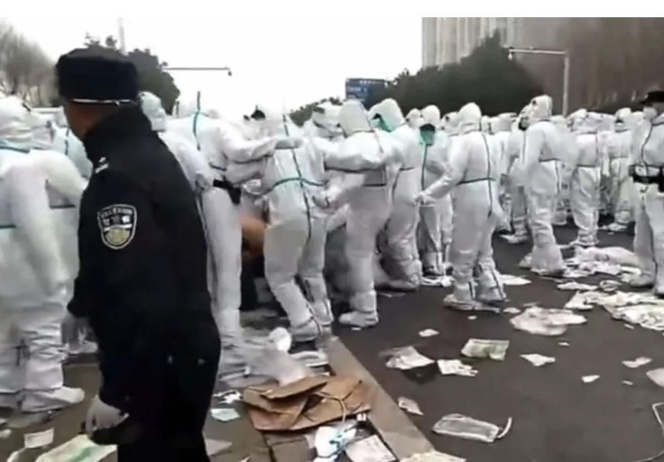 Videos shared on social media appear to show workers being kicked by hazmat-suited officials during Foxconn protests in Zhengzhou, central China.