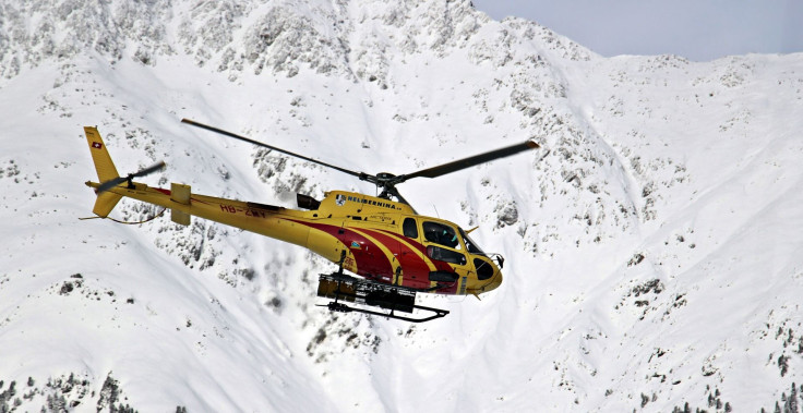 Representation. A rescue helicopter scanning a mountain.