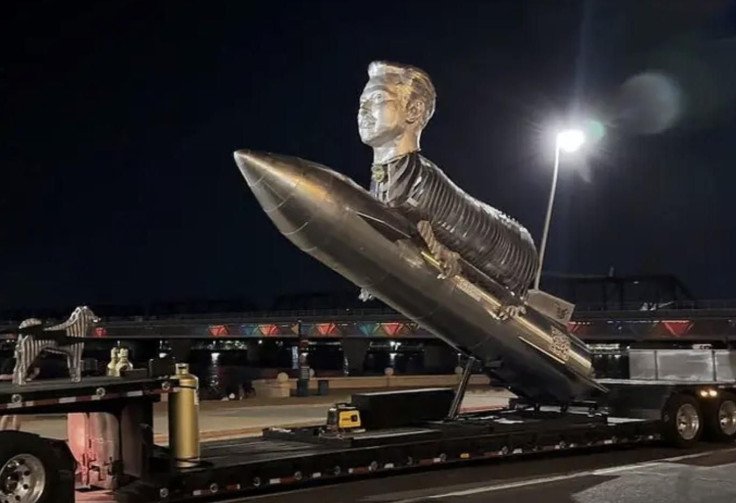 A statue of Elon Musk's head on the body of a goat straddling a rocket