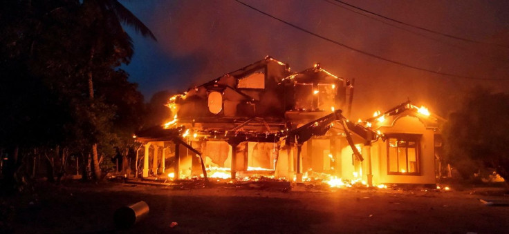 Anti-government demonstrators set fire on the house owned by minister Sanath Nishantha of resigned Prime Minister Mahinda Rajapaksa's cabinet after ruling party supporters stormed anti-govt protest camp, amid the country's economic crisis, in Arachchikatt