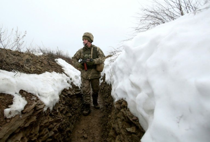 Ukraine has accused Russia of "continuing to wage a hybrid war" after a massive cyberattack