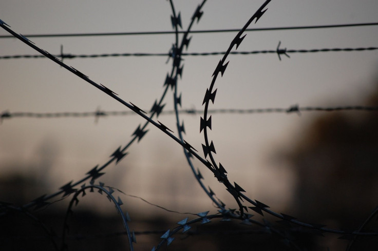 Representation. A prison fence.
