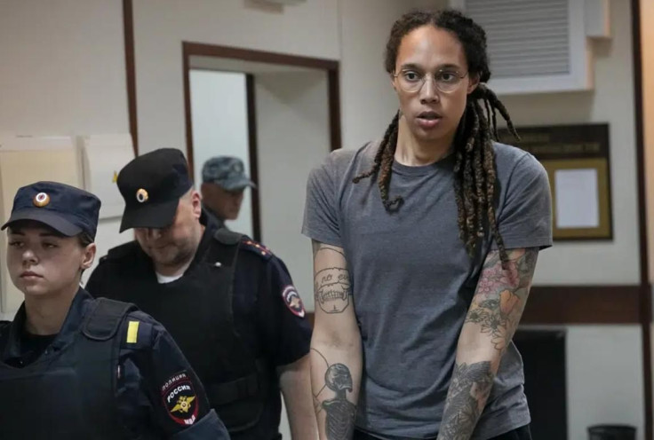 WNBA star and two-time Olympic gold medalist Brittney Griner is escorted from a courtroom after a hearing in Khimki just outside Moscow, on Aug. 4, 2022