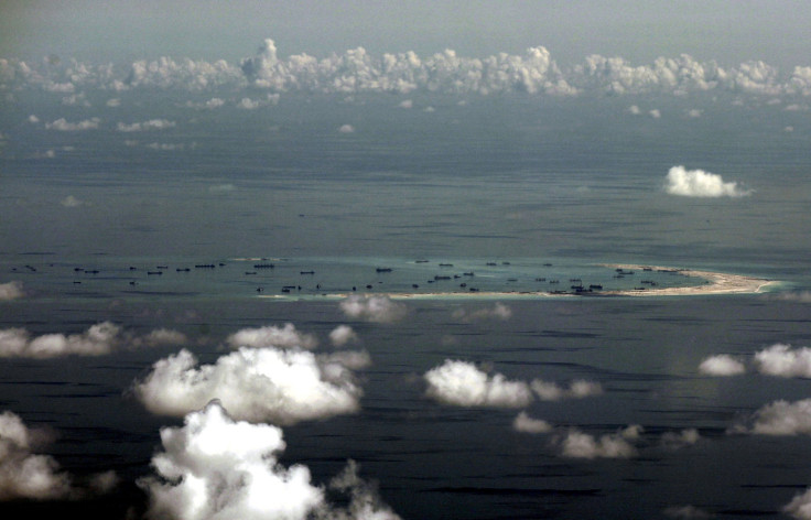 An aerial photo taken though a glass window of a Philippine military plane shows the alleged on-going land reclamation by China on mischief reef in the Spratly Islands in the South China Sea, west of Palawan, Philippines, May 11, 2015.